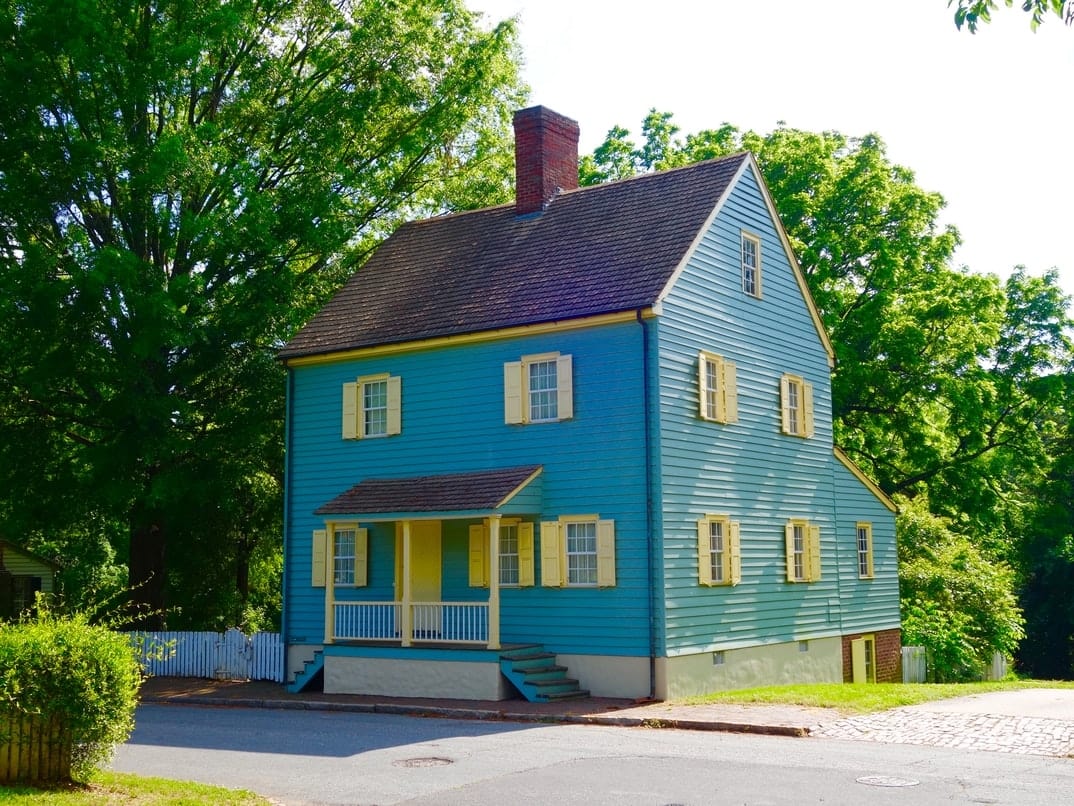 Beautiful blue and yellow painted wooden 18th century house of the Moravian community in Salem, North Carolina.