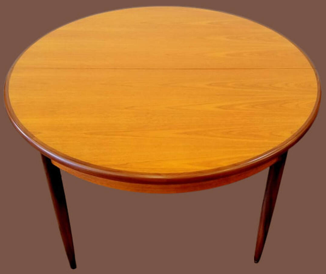 Round to oval dining table #4385 designed by Victor Bramwell Wilkins for E. Gomme's G-Plan Fresco range. Offered in the 
