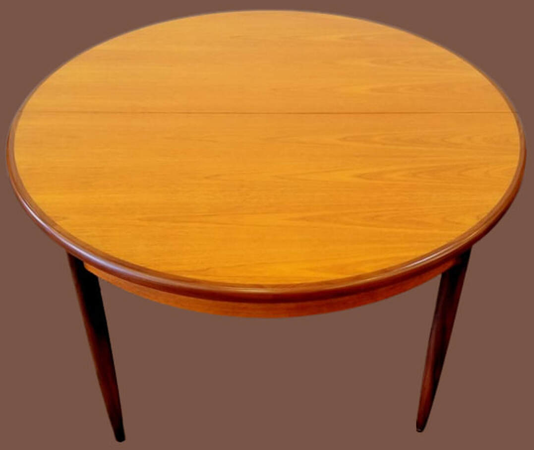 Round to oval dining table #4385 designed by Victor Bramwell Wilkins for E. Gomme's G-Plan Fresco range. Offered in the