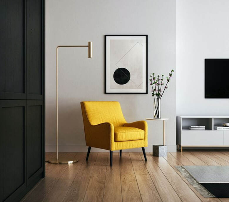 Color photo of yellow Mid-Century Modern armchair in living room.