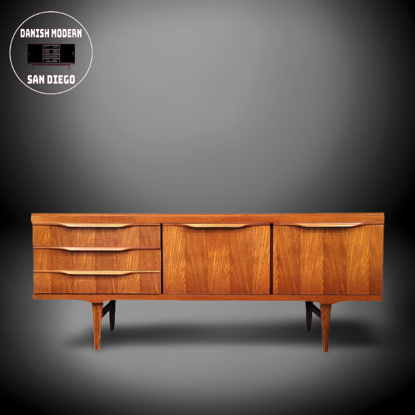 Elliott's of Newbury teak credenza on tapered legs.