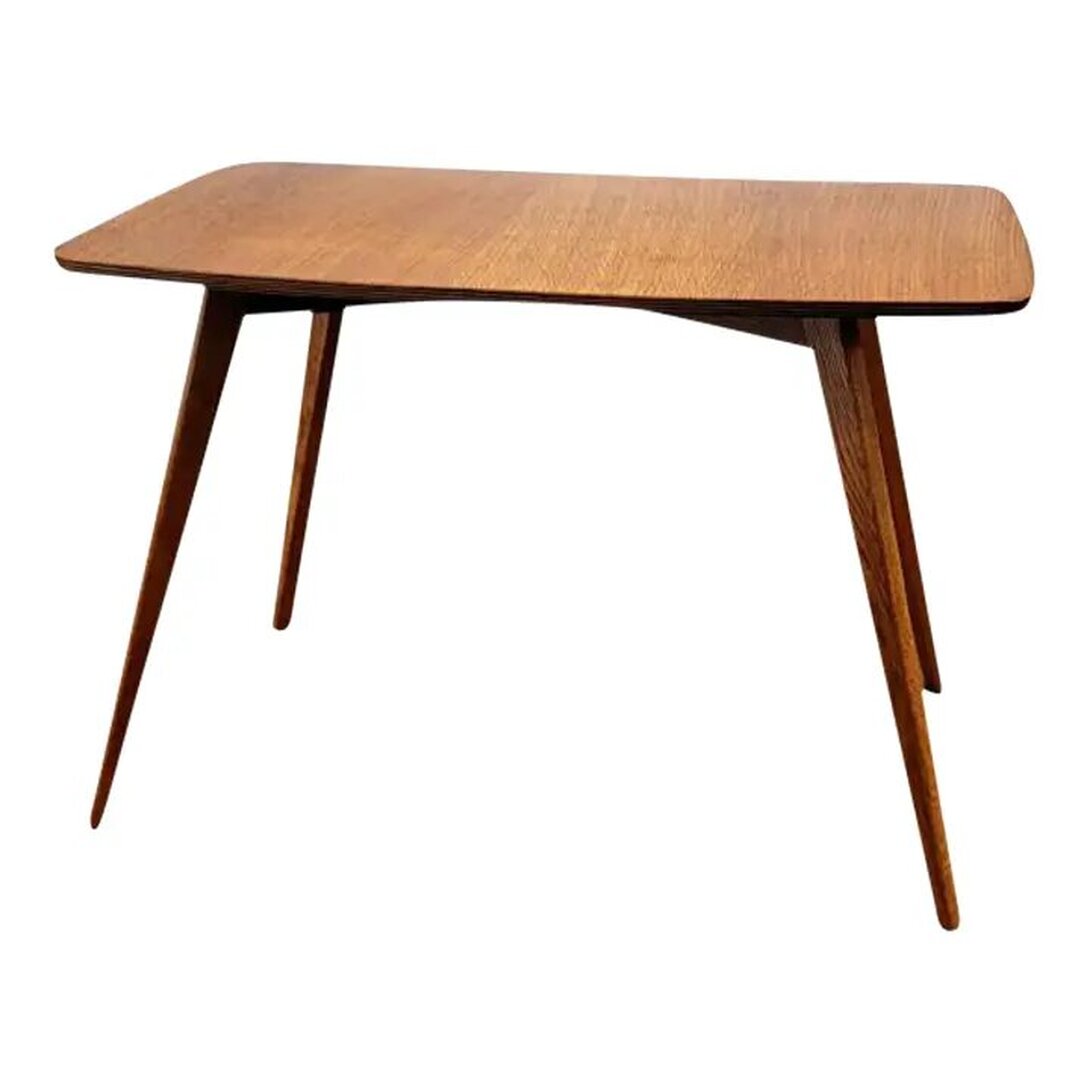 Druce & Co. Ltd., London, small coffee and occasional table in the Danish Modern style has a teak wood veneered rectangular top over solid elm wood splayed legs.  The diminutive size is perfect for a smaller space living coffee table.