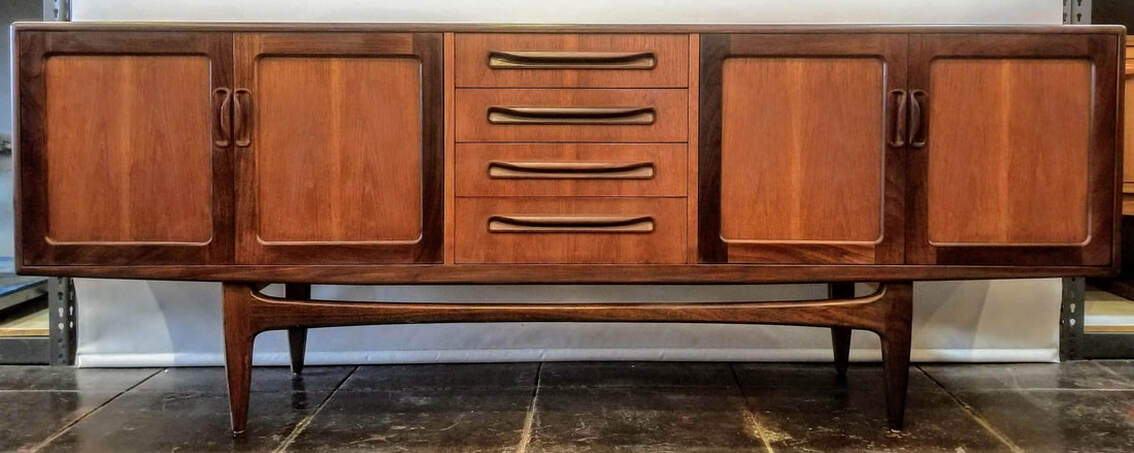 Vintage teak credenza designed by V.B. Wilkins for the G-Plan Fresco Dining Range. Sideboard features double two-door cabinets, one at each end, and four storage drawers at center.